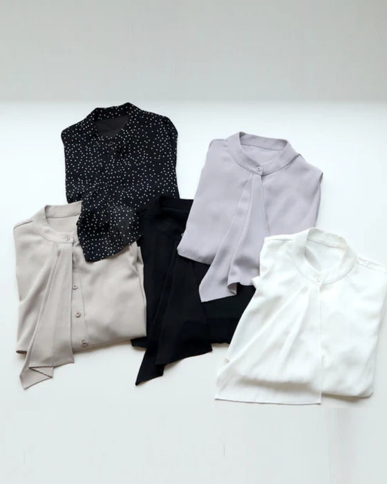 A bowtie blouse that looks neat but not cute. Now available in SML sizes.
