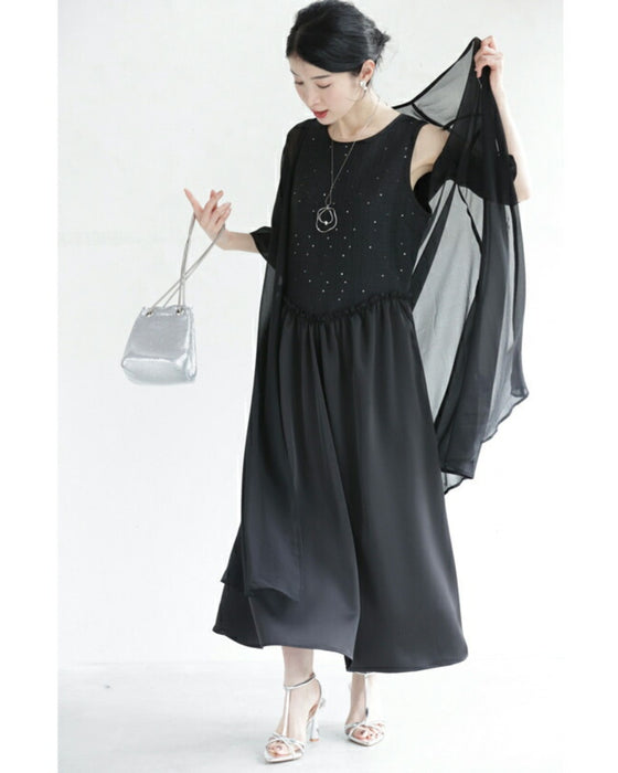 A dress with a tweed-like top and a glossy skirt, sparkling with sequins