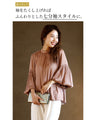 A glossy shirred blouse with 3/4 sleeves and long sleeves for a stylish look
