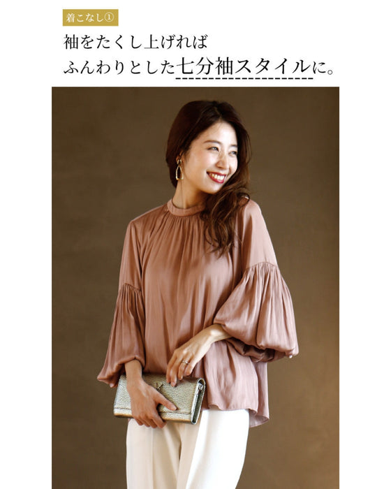 A glossy shirred blouse with 3/4 sleeves and long sleeves for a stylish look