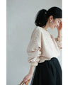 A sweatshirt top with bubble pearls that bubble up like bubbles