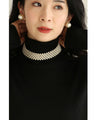 A luxurious, shiny piece for your neck. Wide pearl choker