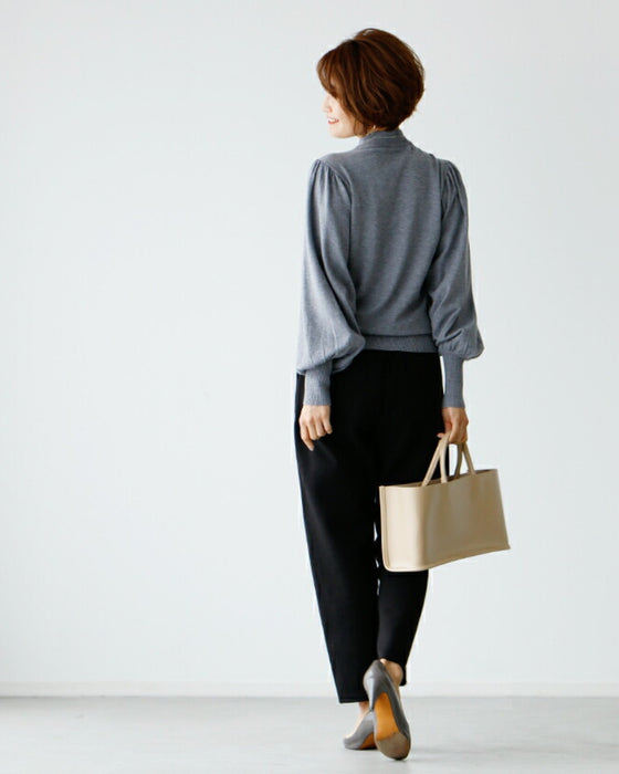 A feminine, evolved version of the turtleneck knit