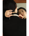 A luxurious, shiny piece for your neck. Wide pearl choker