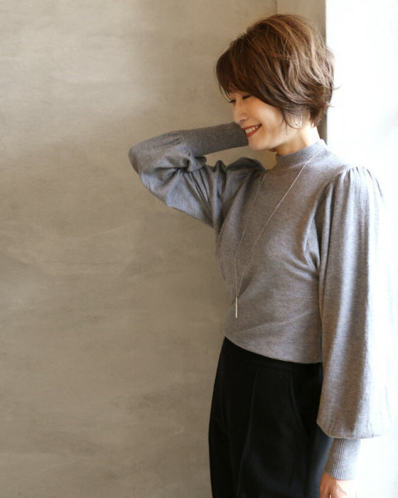 A feminine, evolved version of the turtleneck knit