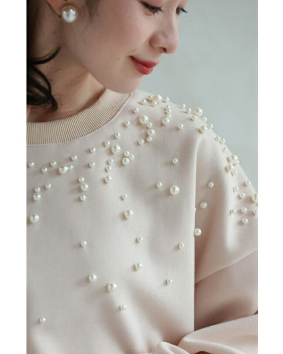 A sweatshirt top with bubble pearls that bubble up like bubbles