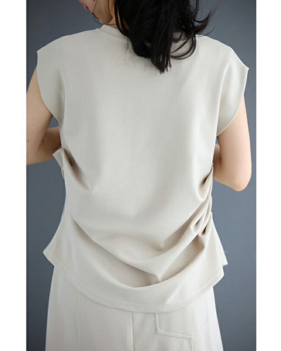 Asymmetrical draped tuck cut and sew top