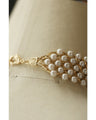 A luxurious, shiny piece for your neck. Wide pearl choker