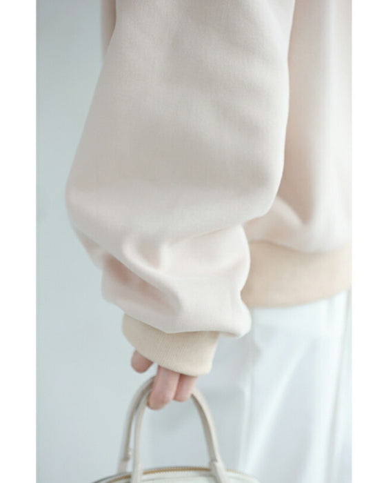 A sweatshirt top with bubble pearls that bubble up like bubbles