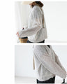 A thin cardigan with delicate floral embroidery