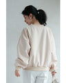 A sweatshirt top with bubble pearls that bubble up like bubbles