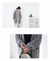Loosely knitted cardigan with loose sleeves