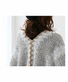 Knit stole with swaying fringes