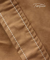 An eye-catching bicolor caramel coat