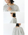A retro polka dot dress that can also be worn as a jacket