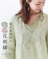 Layered collar and color-coordinated floral embroidery top
