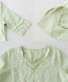 Layered collar and color-coordinated floral embroidery top