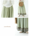 A luxurious embroidered skirt woven with two-color threads