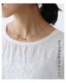 A top with subtle embroidery and delicate details