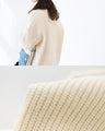 A knitted cardigan with different materials
