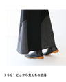 A skirt with a playful asymmetrical design and different material switching