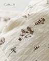 Outerwear surrounded by small flowers