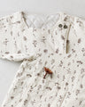 Outerwear surrounded by small flowers