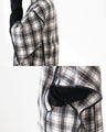 A stylishly concealed poncho-style dress