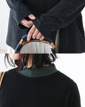 A slightly colored color-coordinated collar top