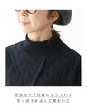 A quilted asymmetrical top that can be worn over the head