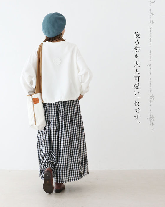 ワンポイントで差がつく遊び心ある一枚トップス