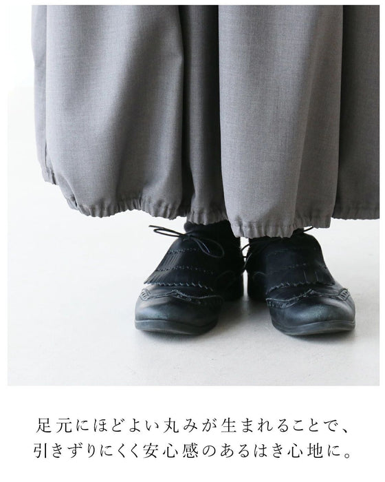 上品な佇まいを演出するバルーンスカート