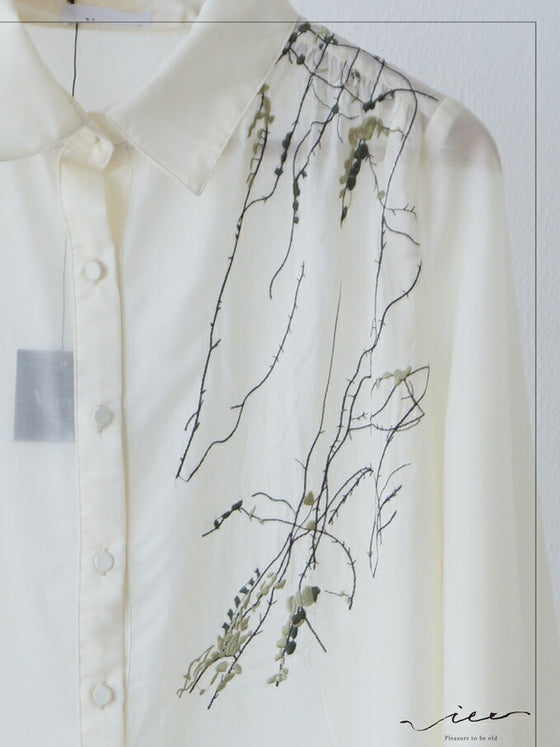 A loose shirt top with a hint of wood