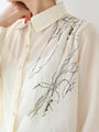 A loose shirt top with a hint of wood