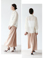 A loose shirt top with a hint of wood