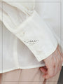 A loose shirt top with a hint of wood