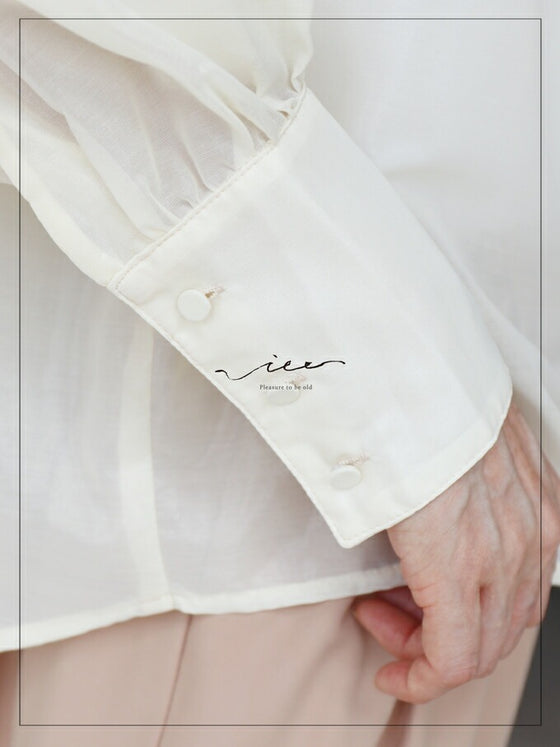 A loose shirt top with a hint of wood