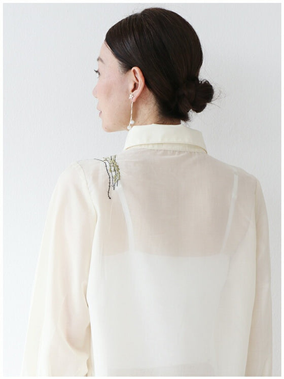 A loose shirt top with a hint of wood