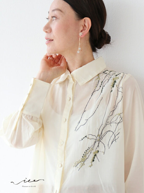 A loose shirt top with a hint of wood