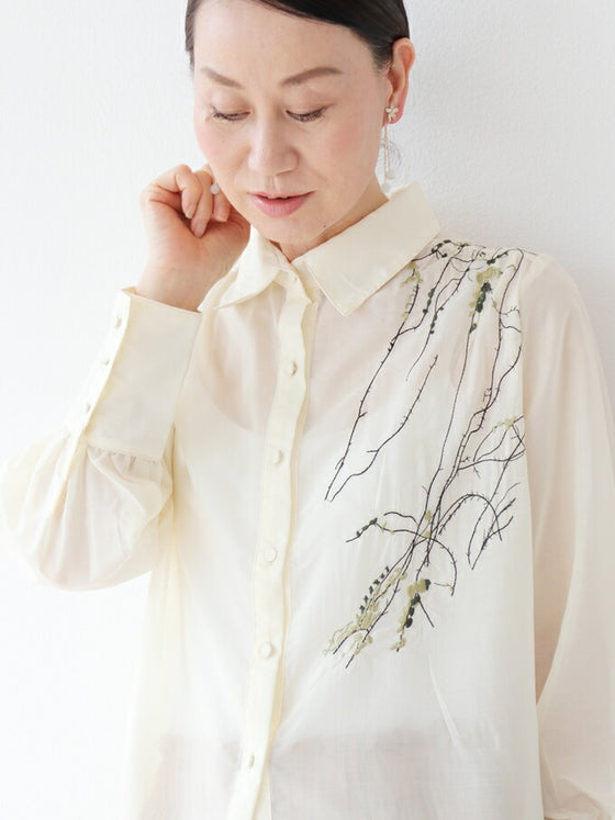 A loose shirt top with a hint of wood