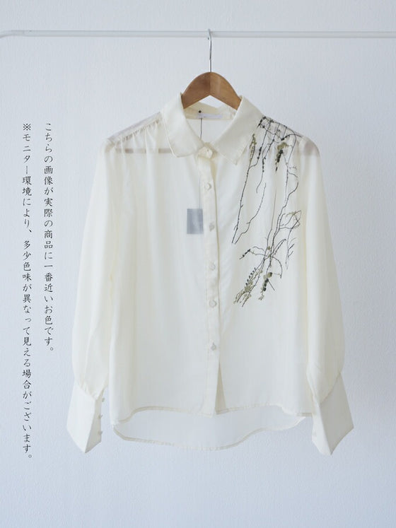 A loose shirt top with a hint of wood