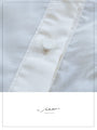 A loose shirt top with a hint of wood