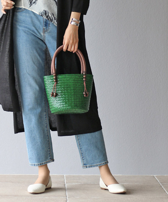 A striking green basket bag for adults