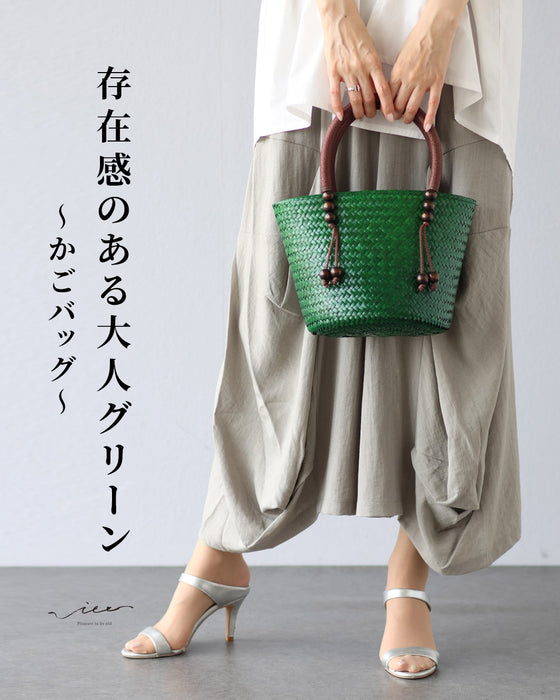A striking green basket bag for adults