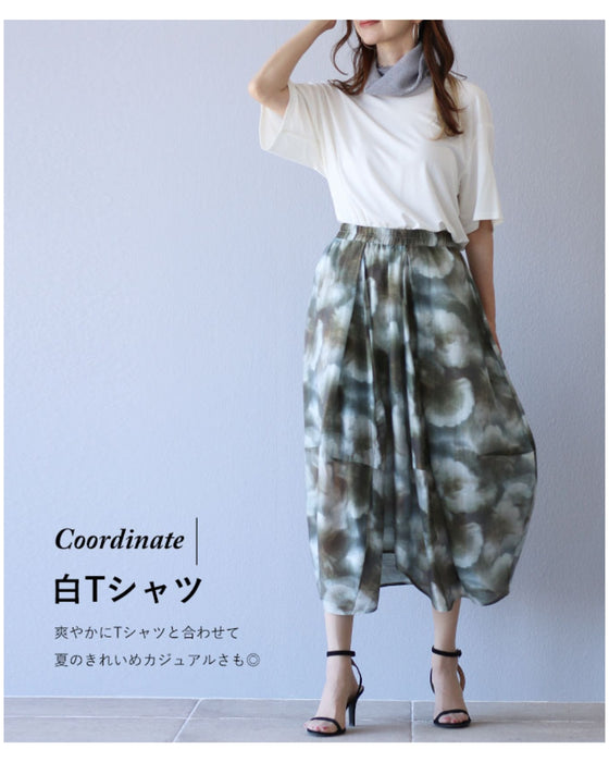 A fluffy cocoon skirt painted in fantastic watercolors
