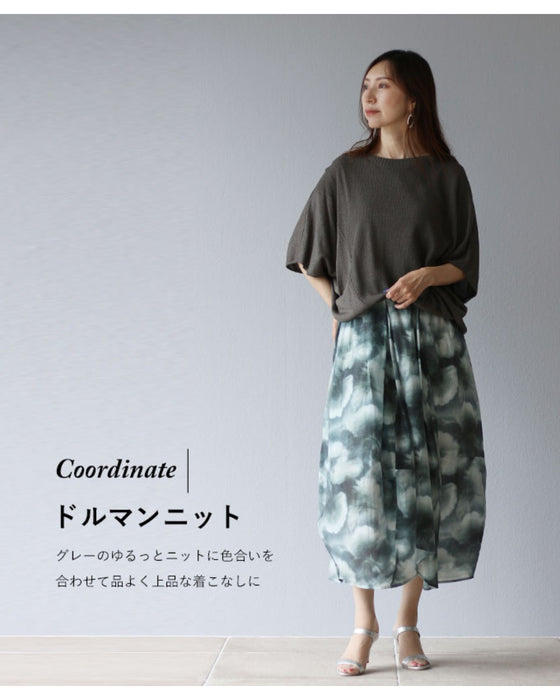 A fluffy cocoon skirt painted in fantastic watercolors
