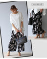 Instantly brighten up your look with these flower pleated pants