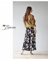 Instantly brighten up your look with these flower pleated pants