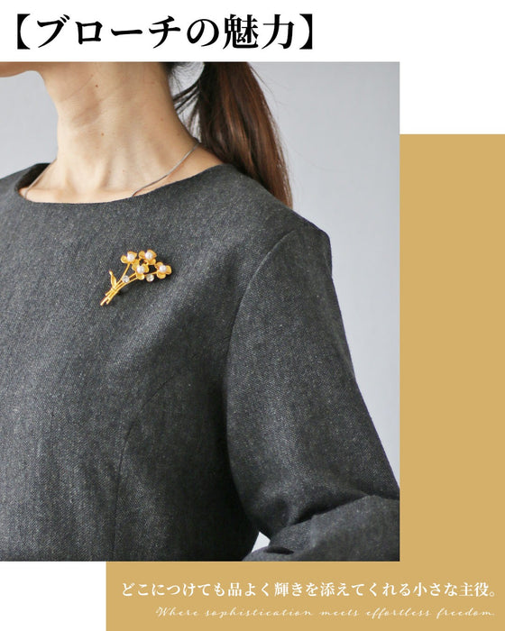 光をまとう花束ブローチ