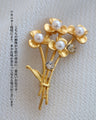 光をまとう花束ブローチ